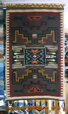 Tejido con dise�o gr�fico con
                            escaleras, flechas y rombos