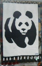 Wandteppich mit einem Panda-B�r in
                            Schwarz-Weiss (WWF-Symbol)