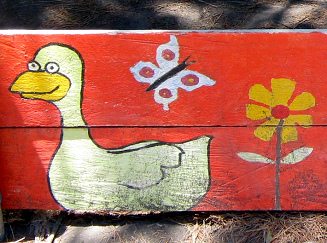 Ente, Blume und Schmetterling