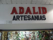 Guayaquil, malecn 2000, tienda de
                        artesana (01), las letras dicen "Adalid
                        Artesanas", puesto no. C48