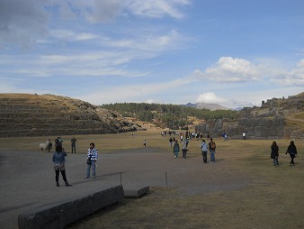 Cusco Sacsayhuam�n: the main field with parts and remnants of high quality of high precision with the giant wall in the background