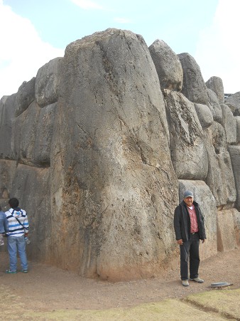 Cusco Sacsayhuamn, giant corner stone with an adult
              person
