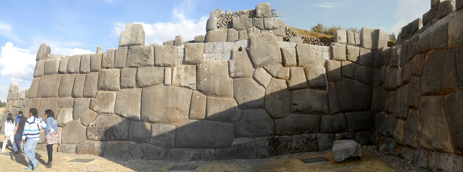 Cusco, Sacsayhuamn, terrace 1, wall with almost rectangular stones and with a flower design - panorama photo 04