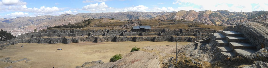 Sacsayhuamán (Cusco), the giant multiple throne on the flattened hill, the view to the zigzag walls on the other side Sacsayhuamán (Cusco), the giant multiple throne on the flattened hill, the view to the zigzag walls on the other side