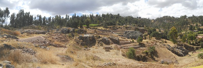 Cusco Sacsayhuam�n, the rock of stairs and throness "Chinchana grande" in the meadows, panorama