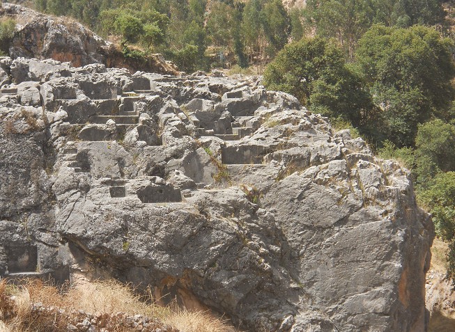 Cusco Sacsayhuam�n, rock of stairs and thrones "Chinchana grande", view 5 with many platforms and thrones, zoom 02