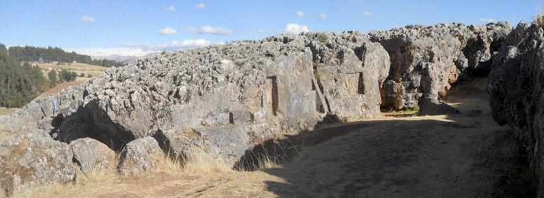 Cusco Sacsayhuam�n, even more mysteries: rock walls of the corridor in black and red with niches and thrones, panorama