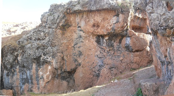 Cusco Sacsayhuam�n, final zone with black and red rock with giant rectangular cuts in the rock, panorama