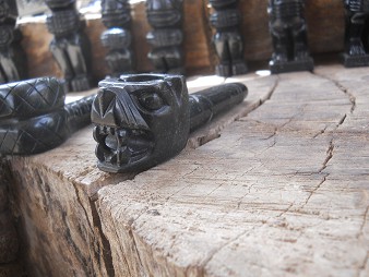 Cusco Sacsayhuam�n 13, the walk to "Zone X", the handicraft workshop with little stone figurines of alabaster, black pipe wiht a dog's face