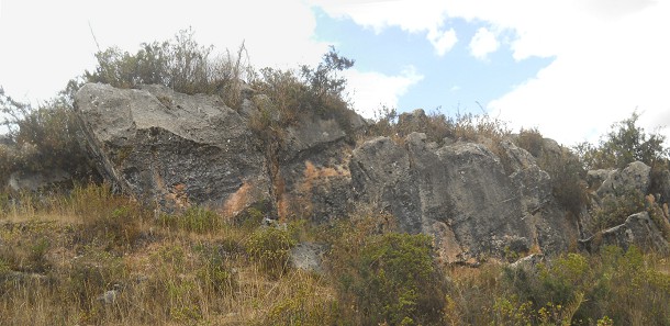 Cusco Sacsayhuam�n 14: Zone X (Laq'o, Laco, Moon Temple), cut rock in black and red, panorama