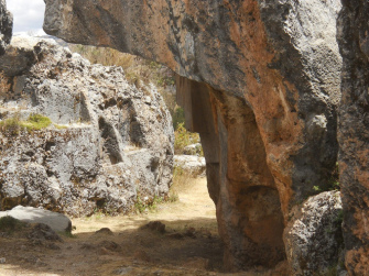 Cusco Sacsayhuam�n, Zone X (Laq'o, Laco, Moon Temple), the overthrown rock in black, red, and white (right) and the black rock with the thrones (in the background)