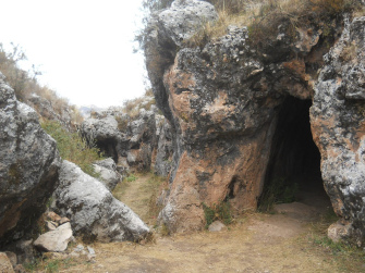Cusco Sacsayhuam�n, Zone X (Laq'o, Laco, Moon Temple), rock in black and red with a cave - and the entrance shows perfect cuts in the rock