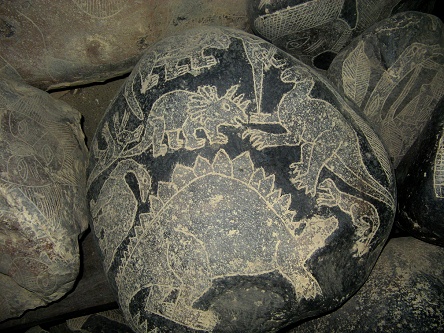 Engraved stone with different dinosaurs
                            01