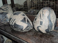 Engraved
                          stones with homo sceneries